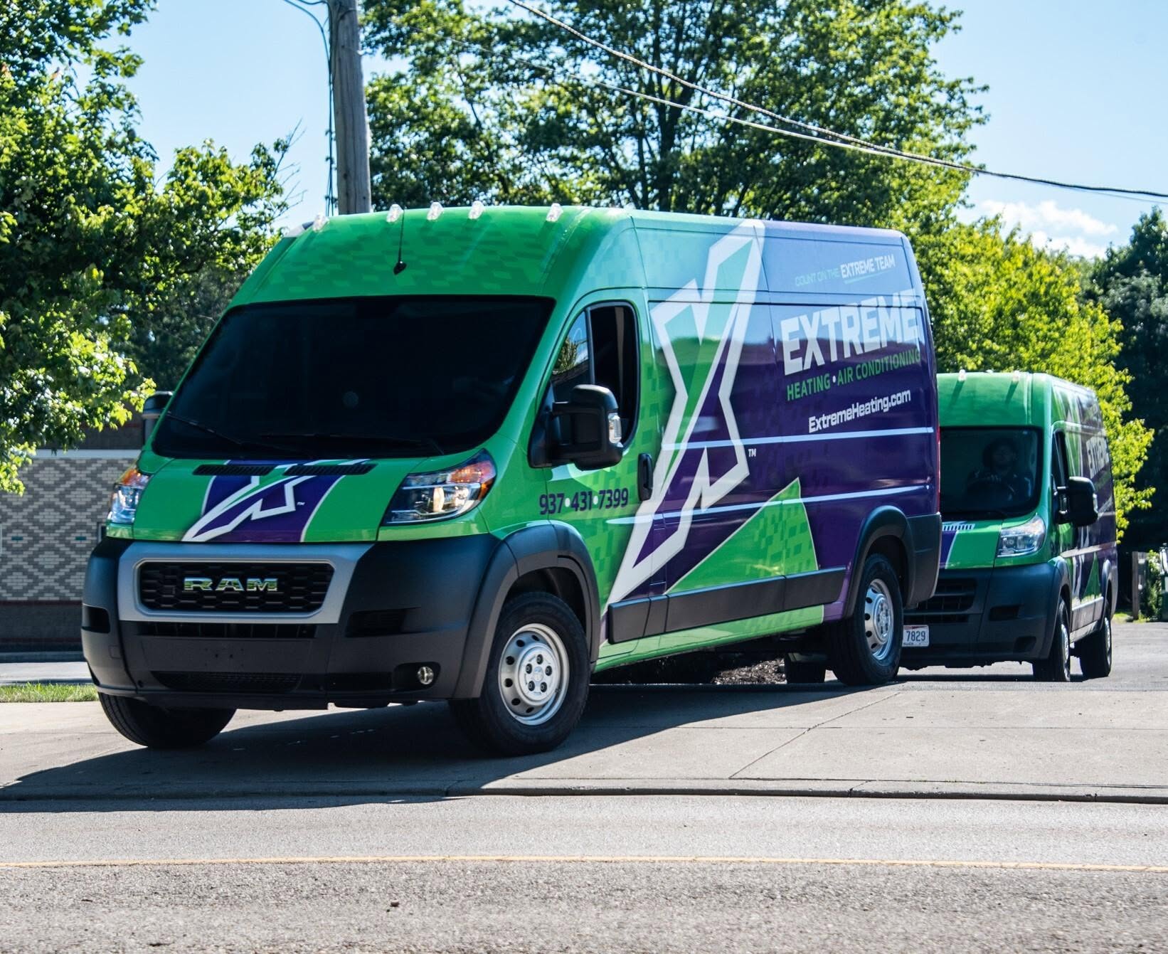 Extreme Heating, Air, Plumbing service vans heading out on calls