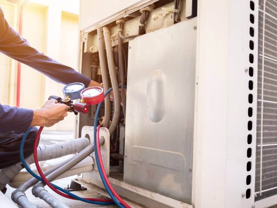 AC Repair Man Working on open AC Unit