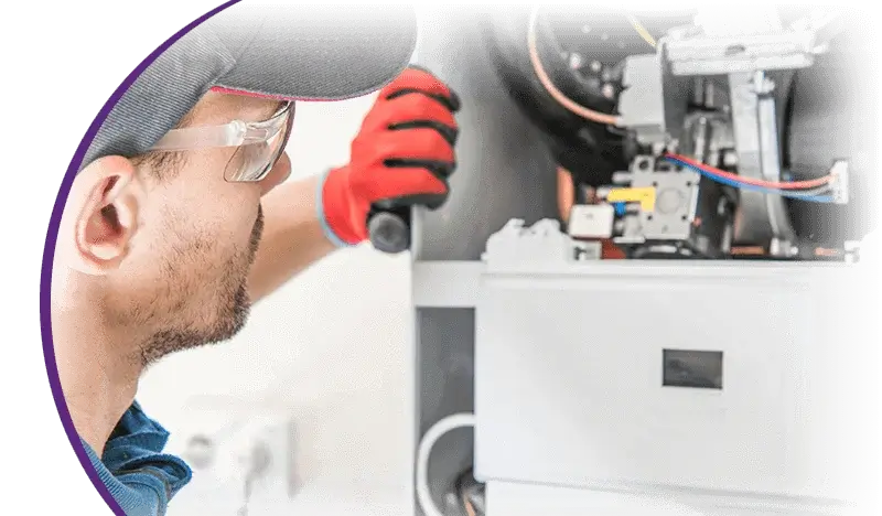 Man working on heating unit