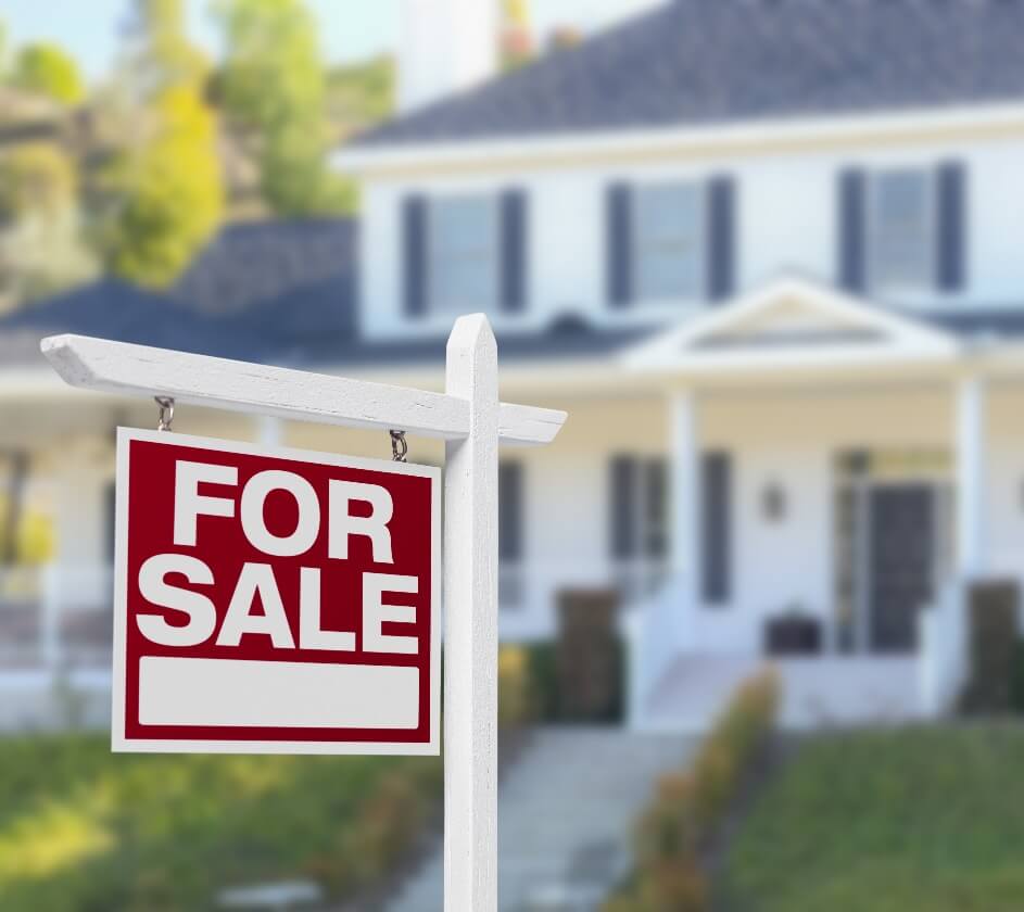 For Sale Sign In Front of Home