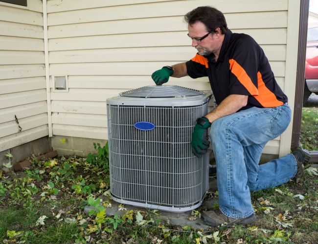 HVAC Technican working on a air conditioner in West Chester, Ohio